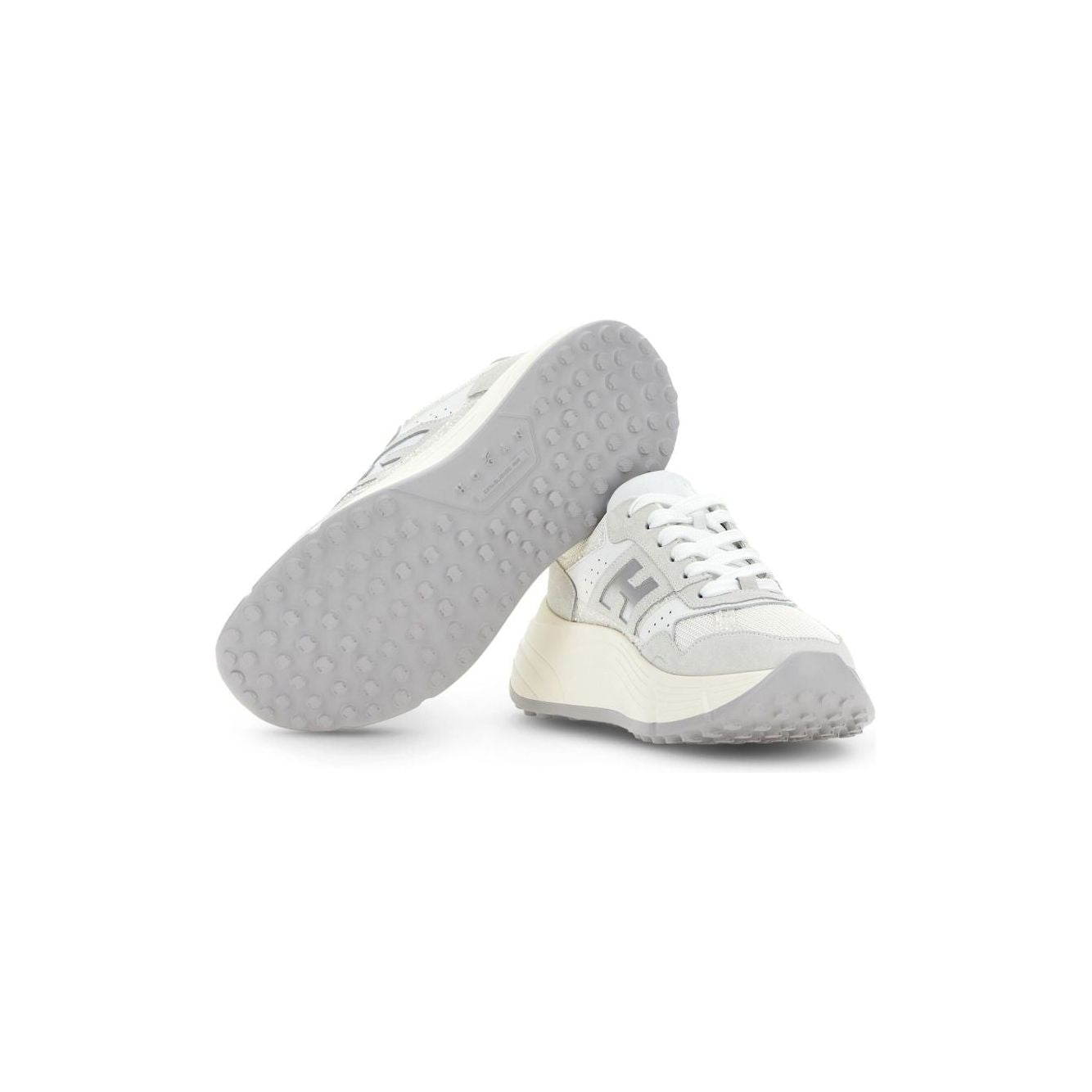 White Hogan PRE sneakers with silver-tone leather, lace-up front, padded ankle, perforated sides, and embossed logo on rubber sole.