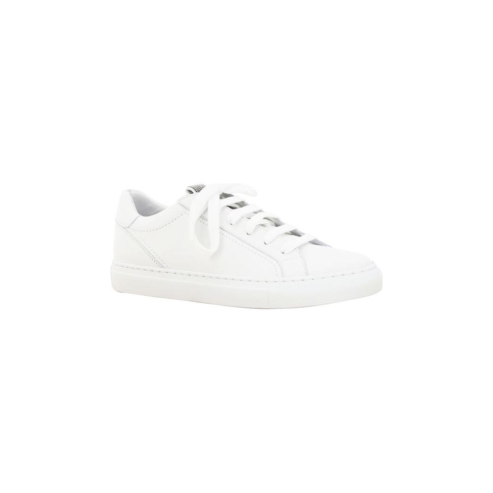 White Brunello Cucinelli calfskin sneakers with elongated toe and lace-up front, featuring a jeweled front label and flat sole.
