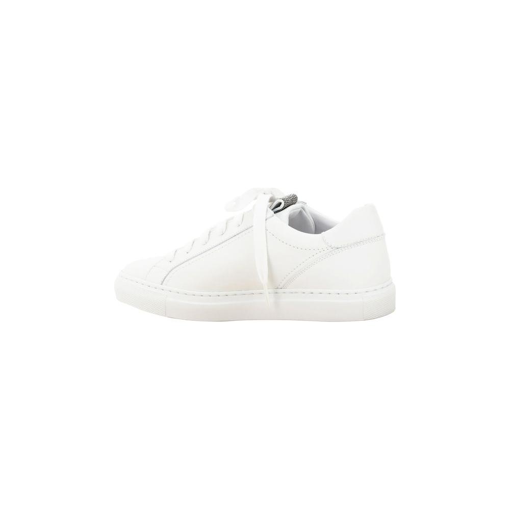 Side view of Brunello Cucinelli calfskin sneakers with elongated toe, lace-up front, glittering jewel embellishments, and flat sole.