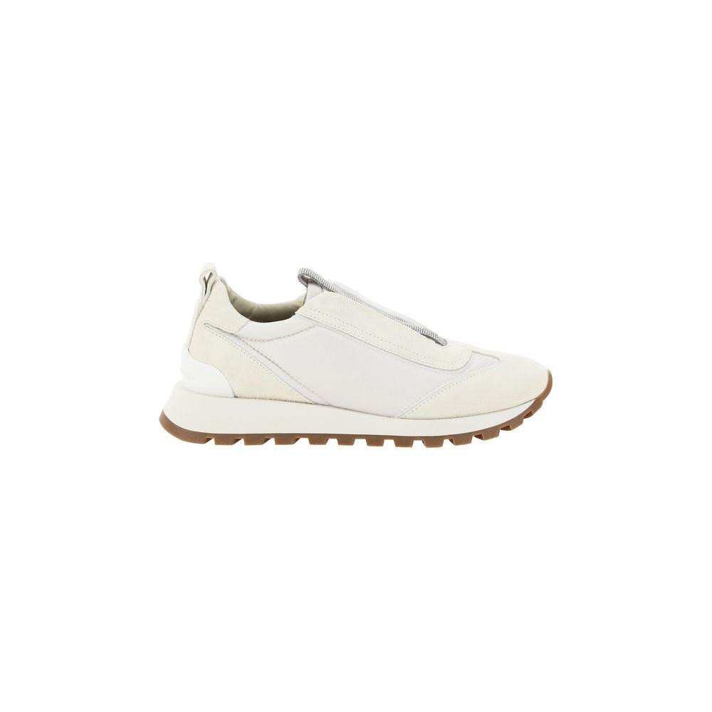 Brunello Cucinelli slip-on sneakers with round toe, knurled sole, suede details, and jewel-embellished front band, embossed brand monogram.