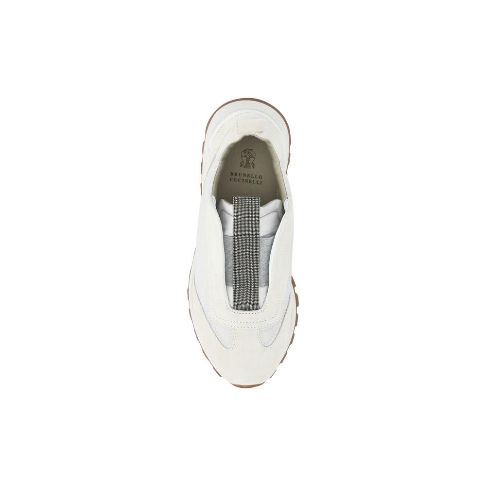 Brunello Cucinelli slip-on sneakers with round toe, knurled sole, jewel embellishments, and suede details, top view image.
