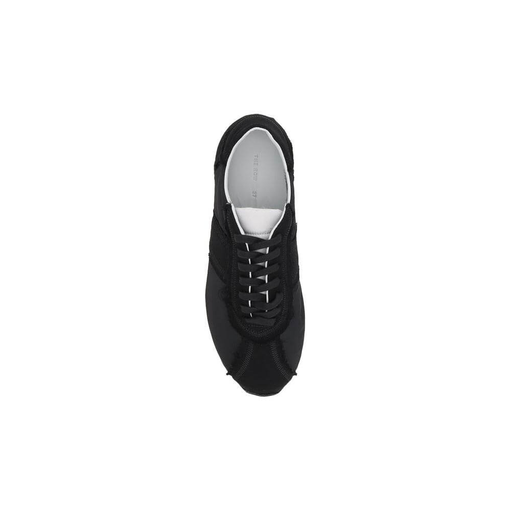 The Row Moveo Sneakers - black lace-up sneakers with round toe, tone-on-tone slanted bands, modern strappy detail, branded insole.