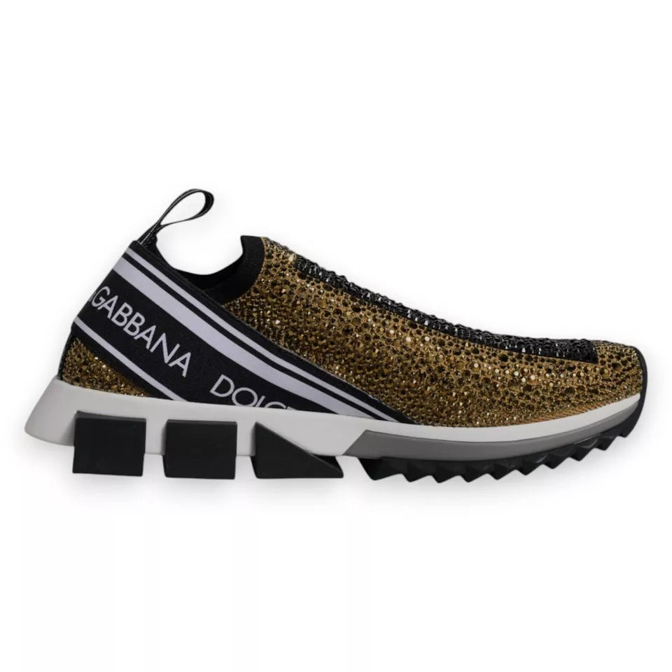 Dolce & Gabbana gold rhinestone Sorrento sneakers with black details and ridged rubber sole, luxury slip-on shoes.