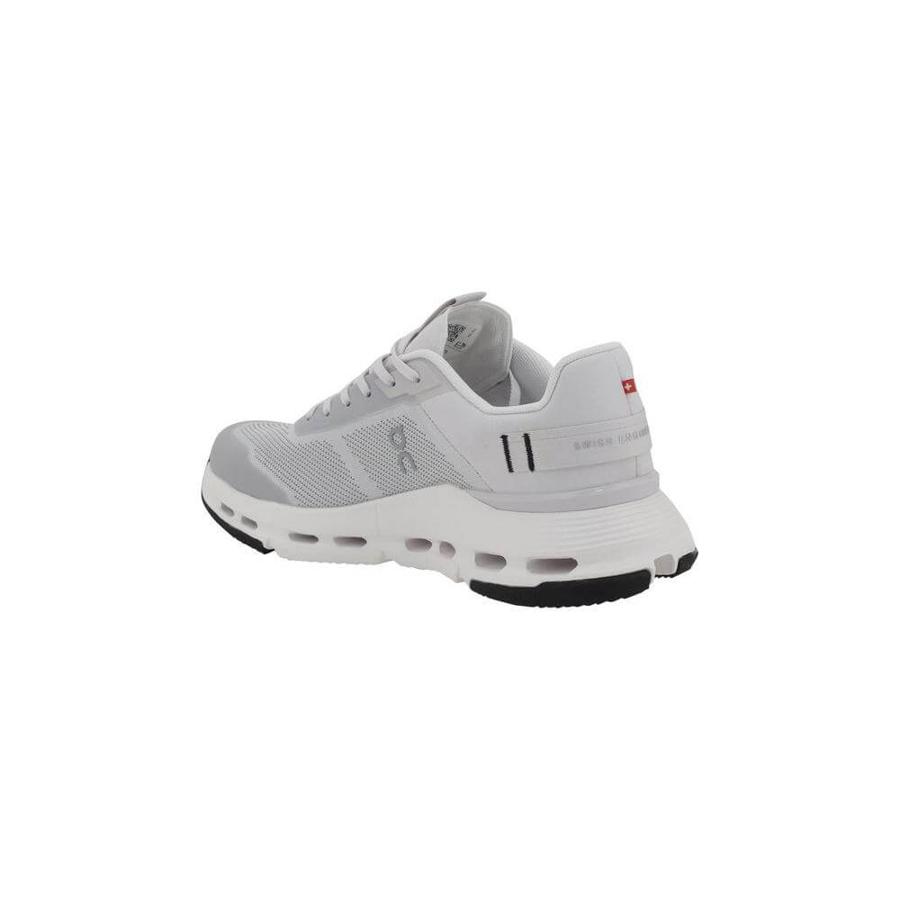Side view of ON Cloudnova Form 2 TT Sneakers with white upper, lace-up closure, logo detail, and perforated sole design.