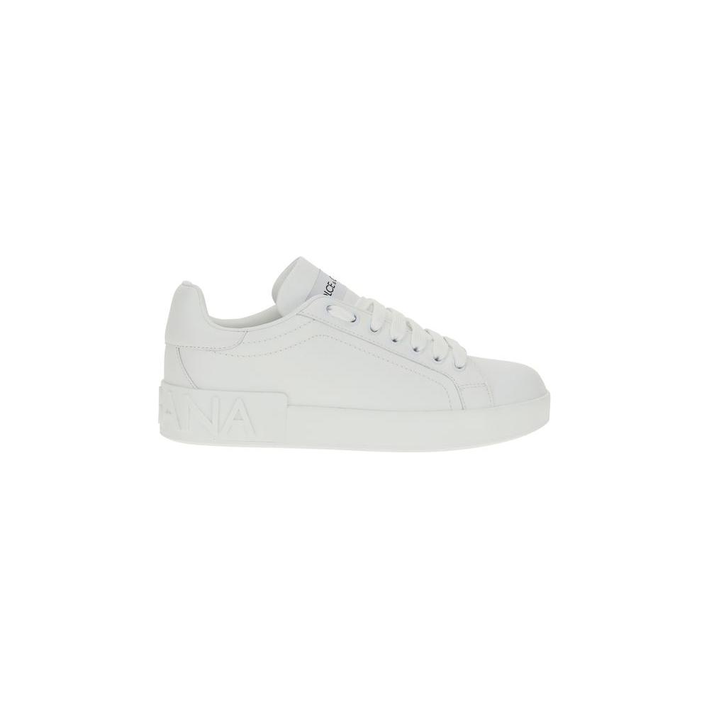 White Dolce & Gabbana leather sneakers with lace-up front, round toe, and flat sole featuring the iconic monogram design.