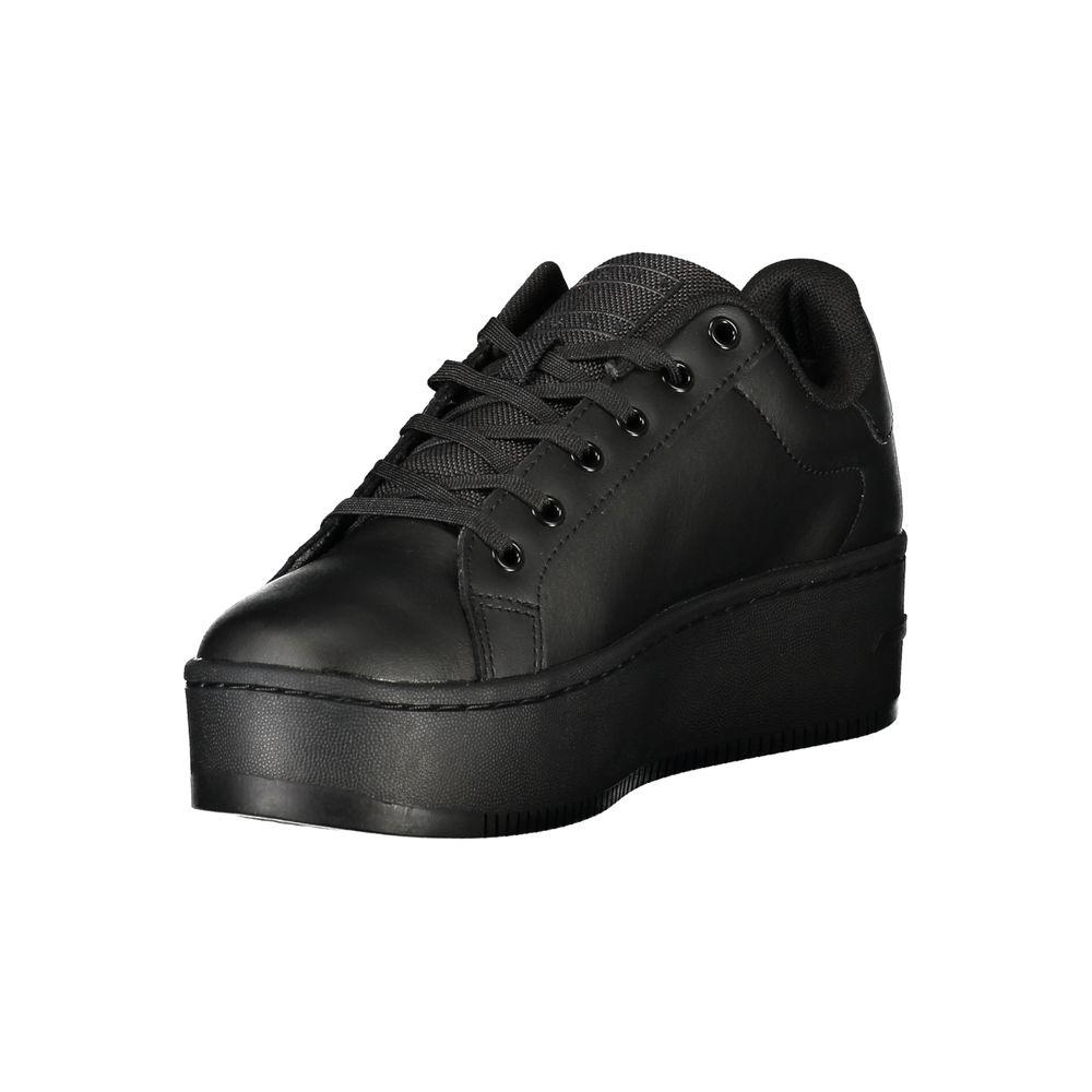 Tommy Hilfiger black women's sneaker featuring a 5 cm wedge, lace-up design, and iconic logo, blending style and comfort.