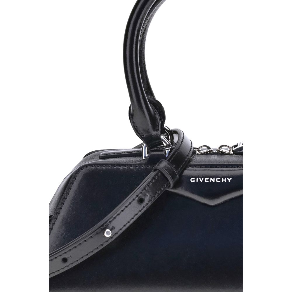 Close-up of Givenchy Antigona East-West Mini Handbag with leather handles and signature logo.