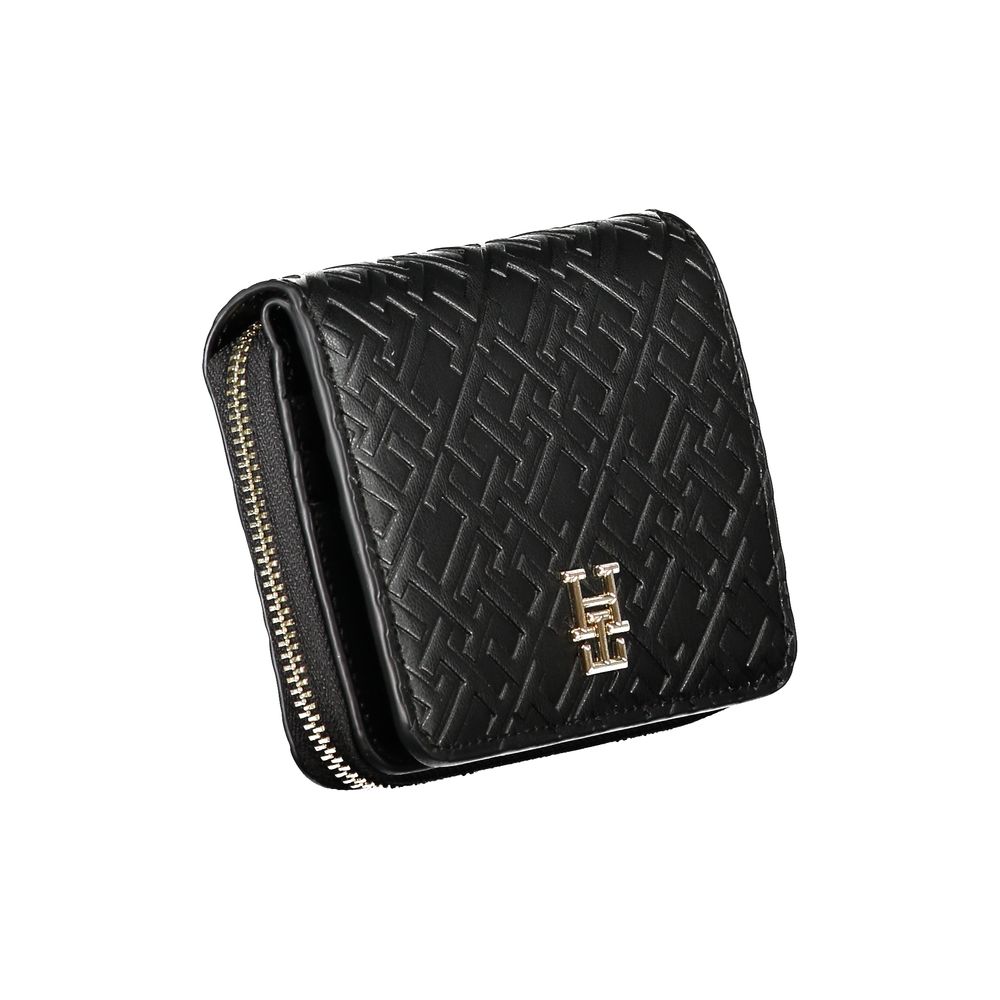 Tommy Hilfiger Black Polyethylene Wallet with zip closure, logo, and card spaces.