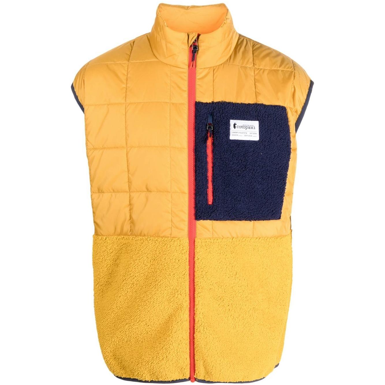 Mustard yellow COTOPAXI padded vest with chest logo patch, front zip fastening, and front pockets. Sleeveless trico hybrid design.