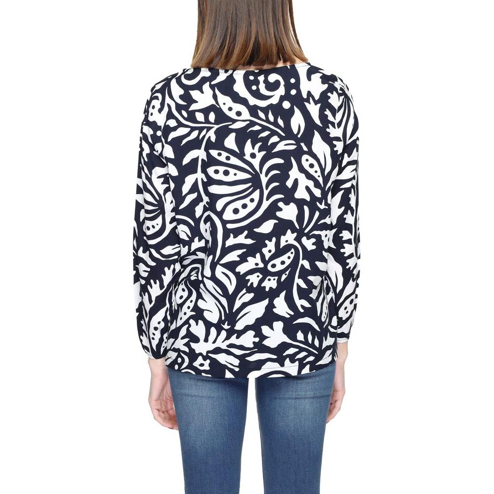 Back view of woman wearing Street One blue viscose shirt with long sleeves and white floral pattern, 100% viscose fabric.