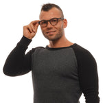 Man wearing Ermenegildo Zegna Brown Men Glasses Frame with full-rim trapezium style, plastic material, and spring hinge feature.