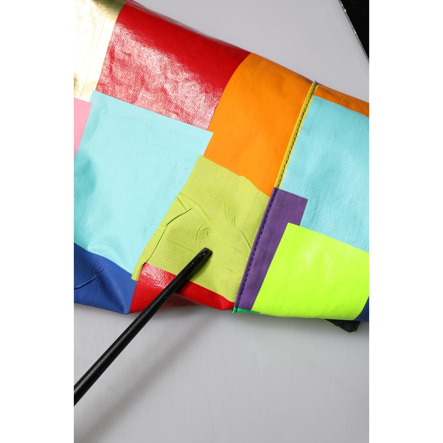 Front view with bag zipped and handles upright.