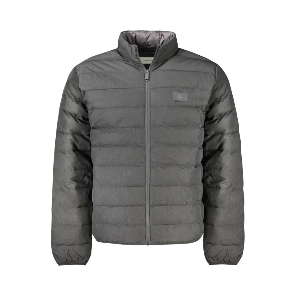 Calvin Klein Black Polyamide Men Jacket with discreet logo, sustainable design, sleek silhouette, and durable comfort.