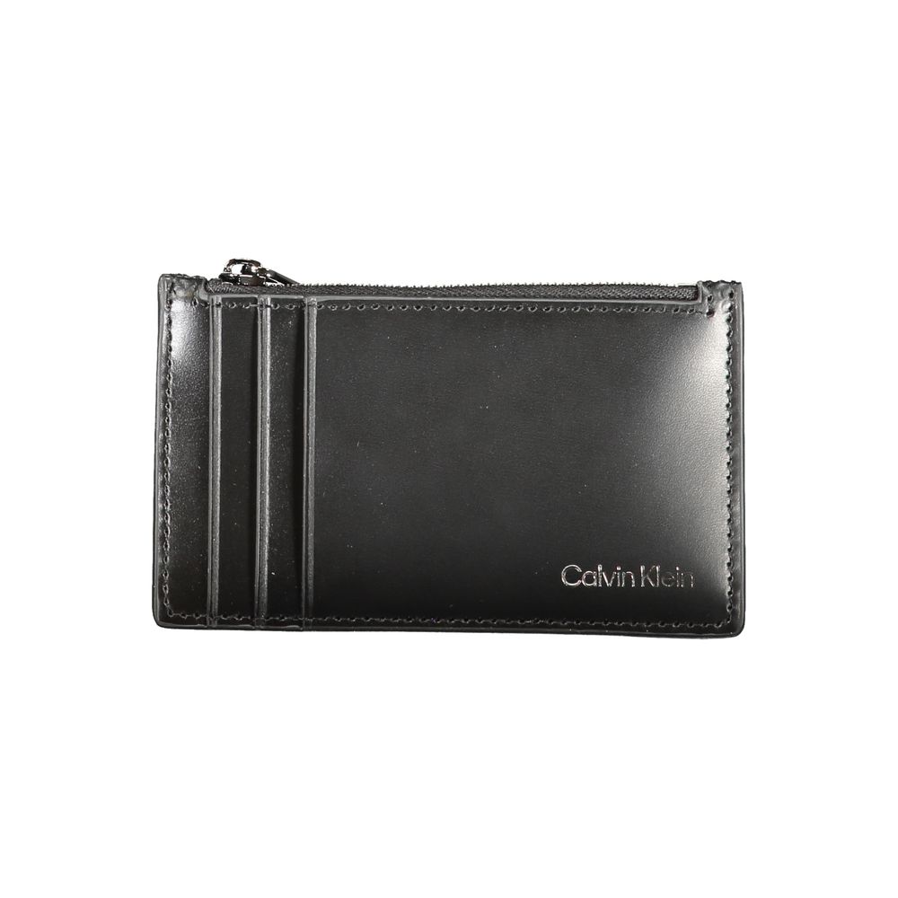 Calvin Klein Black Leather Wallet with card holder, central zip pocket, spaces for cards, and logo.