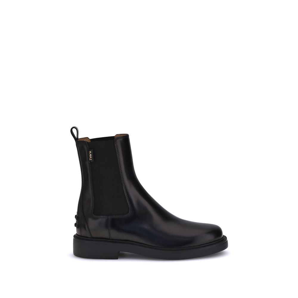 Tod's Black Calf Leather Bos Taurus Chelsea Boots with elastic inserts and rubber sole with pebbles for comfort and grip.