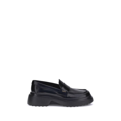 Tod's Black Rubber Platform Loafers with rounded toe and logo plaque.