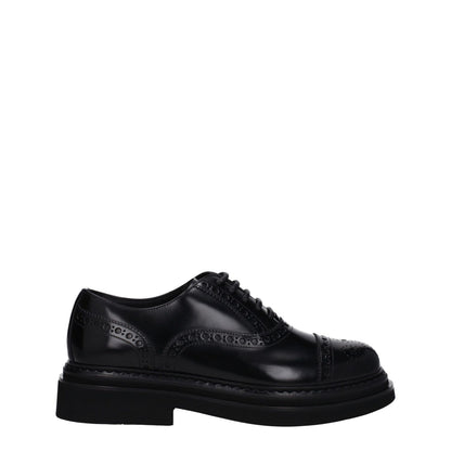 Dolce & Gabbana Black Leather Oxfords And Derbies with lace up closure and mid heels, featuring vintage effect and round toe design.