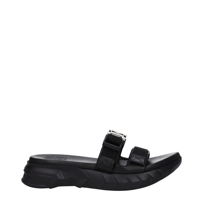 Givenchy Black Fabric Slippers with open toe and mid heels, featuring front logo, silver details, and rubber sole. MPN: BH301QH1A2001.
