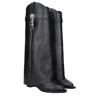 Givenchy Black Leather Boots with aged effect, side detail, wedge heel, and pointy toe.
