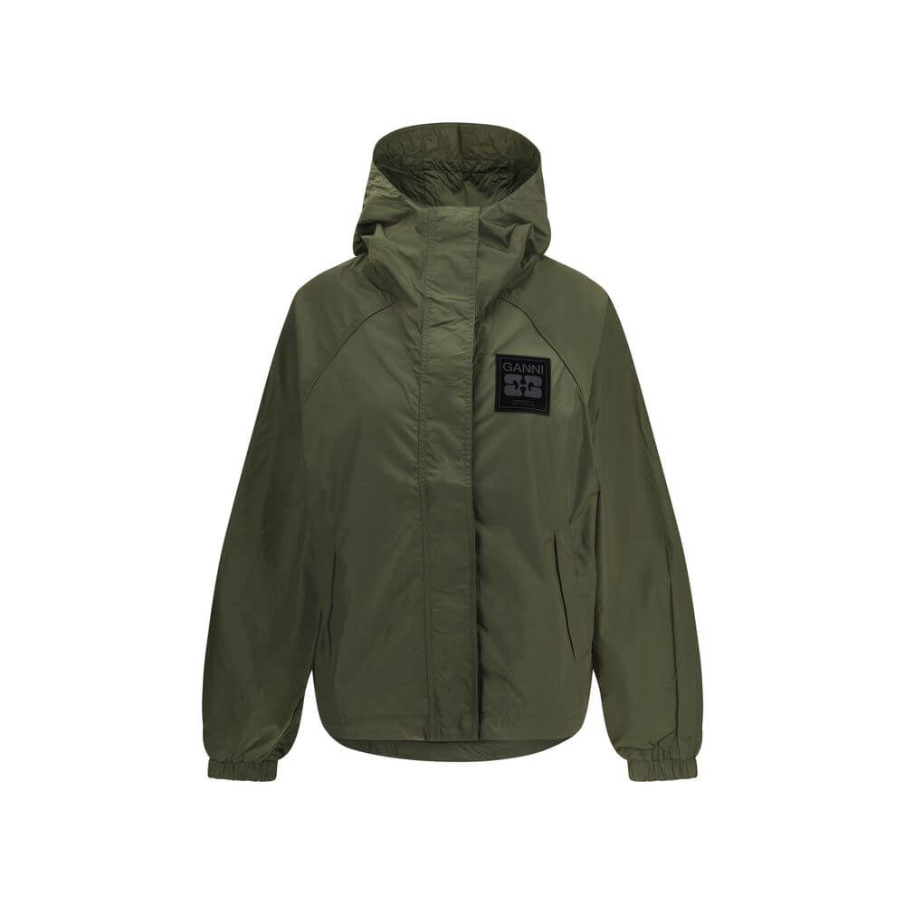 Ganni Green Nylon Shell Jacket with hood, front zipper, side pockets, and GANNI logo patch. Waterproof and stylish outerwear.