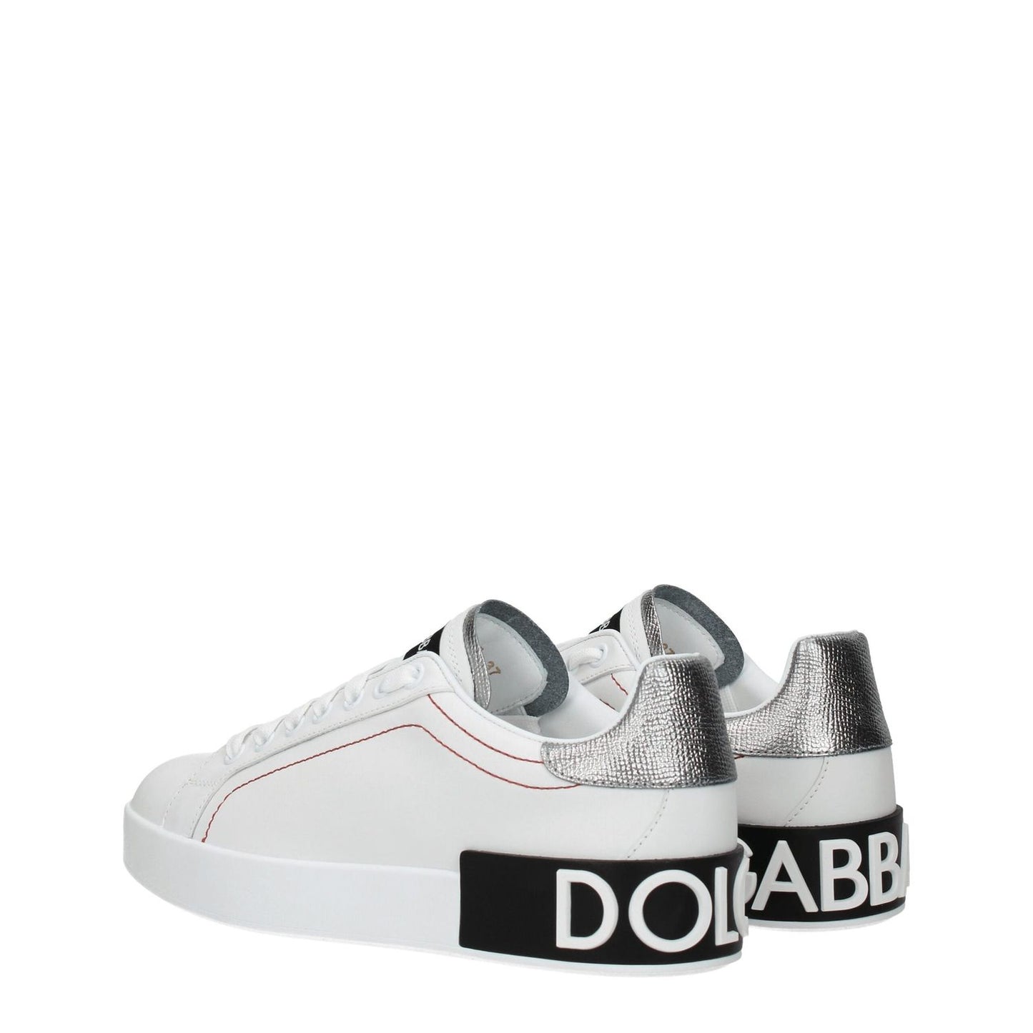Dolce & Gabbana White Leather Low Top Sneakers with silver accents and branded soles, featuring lace-up closure and rubber sole.