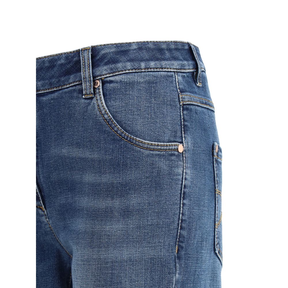 Close-up of Brunello Cucinelli Skinny Jeans with five-pocket design and jewel detail, featuring a button-and-zip closure, AW25 collection.