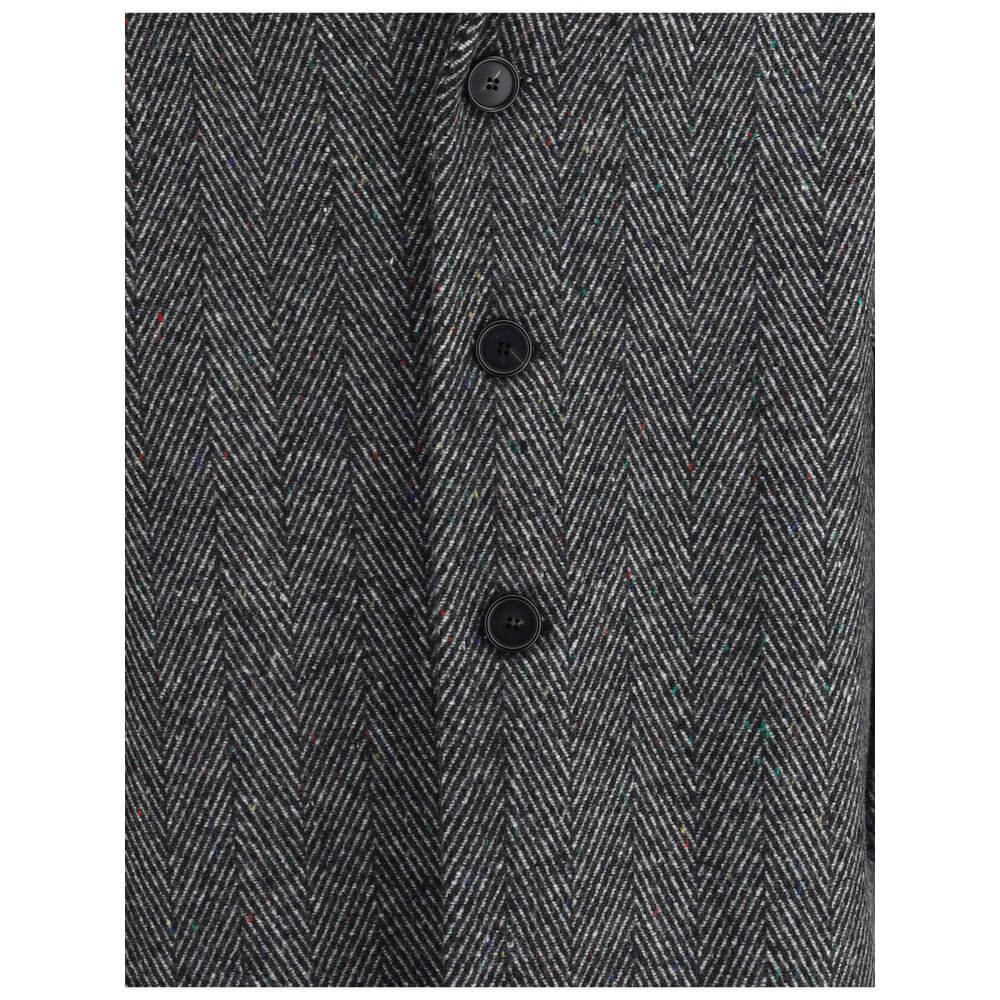 Close-up of herringbone pattern on Givenchy Gray Wool Coat with button fastening, showcasing elegant design and craftsmanship.