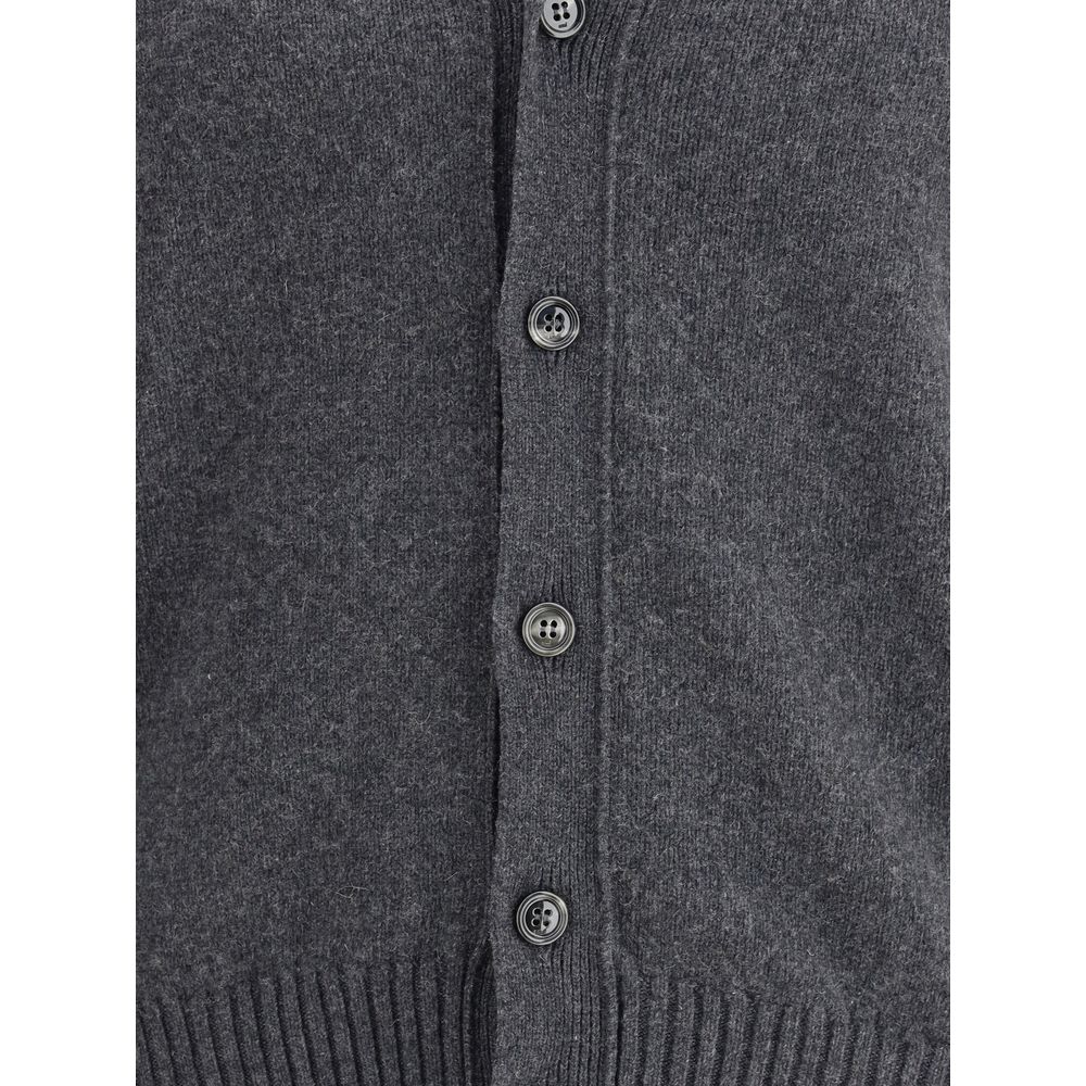 Buttoned front of the Ami Paris Gray Cashmere Cardigan with ribbed cuffs for a refined design and embroidered Ami De Coeur logo.