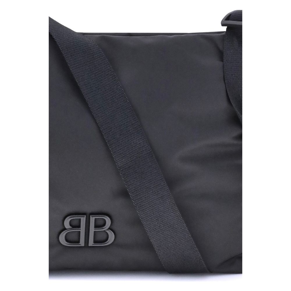 Balenciaga Black Fabric Shoulder Bag with logo and adjustable strap for versatile, everyday style.