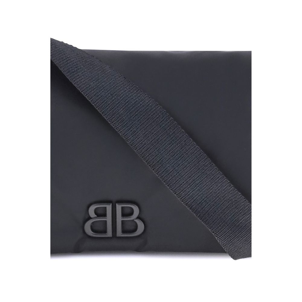 Close-up of Balenciaga Black Polyamide Shoulder Bag with tone-on-tone logo plaque and adjustable strap