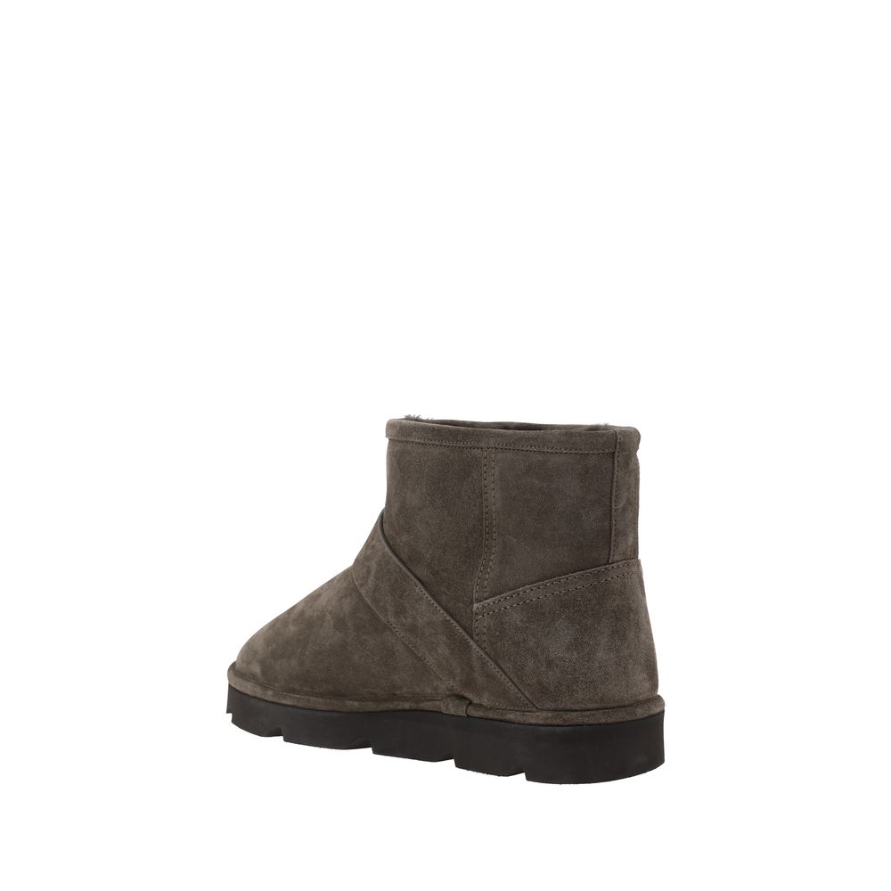 Brunello Cucinelli Brown Calf Leather Bos Taurus Ankle Boots with knurled sole and adjustable buckle, rear view.