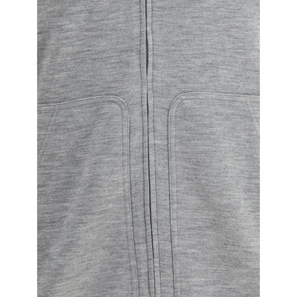 Close-up of Brunello Cucinelli Gray Cashmere Sweatshirt showing patch welt pockets and monochrome design.