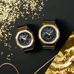 CASIO G-SHOCK Mod. OAK METAL COVERED OAK METAL COVERED - GOLD wristwatches on black and gold background.