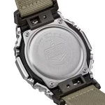 Back view of CASIO G-SHOCK Mod. OAK METAL COVERED - UTILITY SERIE KHAKI BEIGE wristwatch showing metal case and fabric strap.