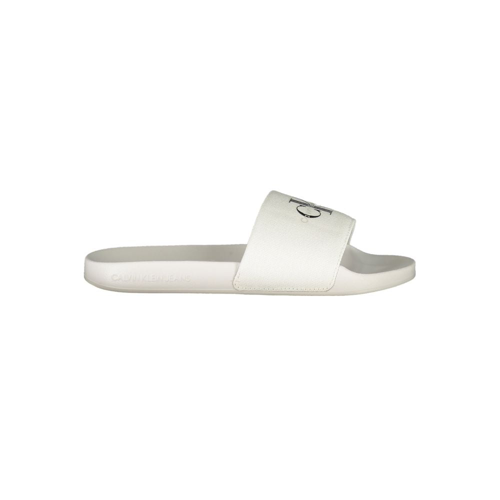 Calvin Klein White Polyester Women Sandal featuring logo-print design, ideal for poolside or casual outings, showcasing contemporary elegance.