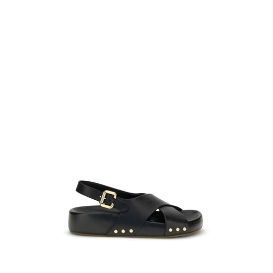 Chloé Mae Sandals with black crossed straps, gold Paddington buckle, and studs, featuring a comfortable anatomical insole.