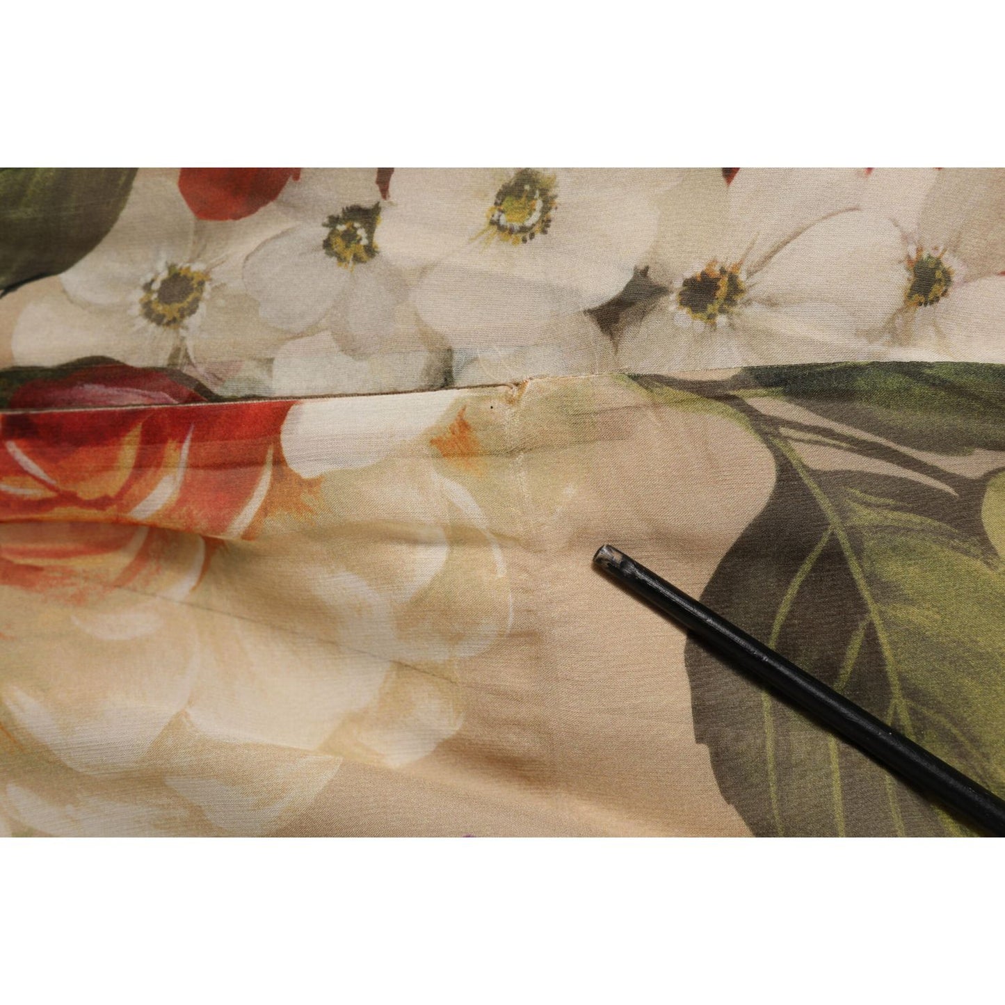 Close-up of Dolce & Gabbana Beige Floral Sleeveless A-line Mini Dress fabric detailing.