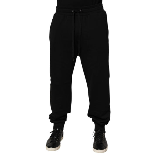 Dolce & Gabbana Black Cotton Drawstring Logo Sweatpants Pants featuring ribbed hems and logo patch on back. Ideal for luxury casualwear.