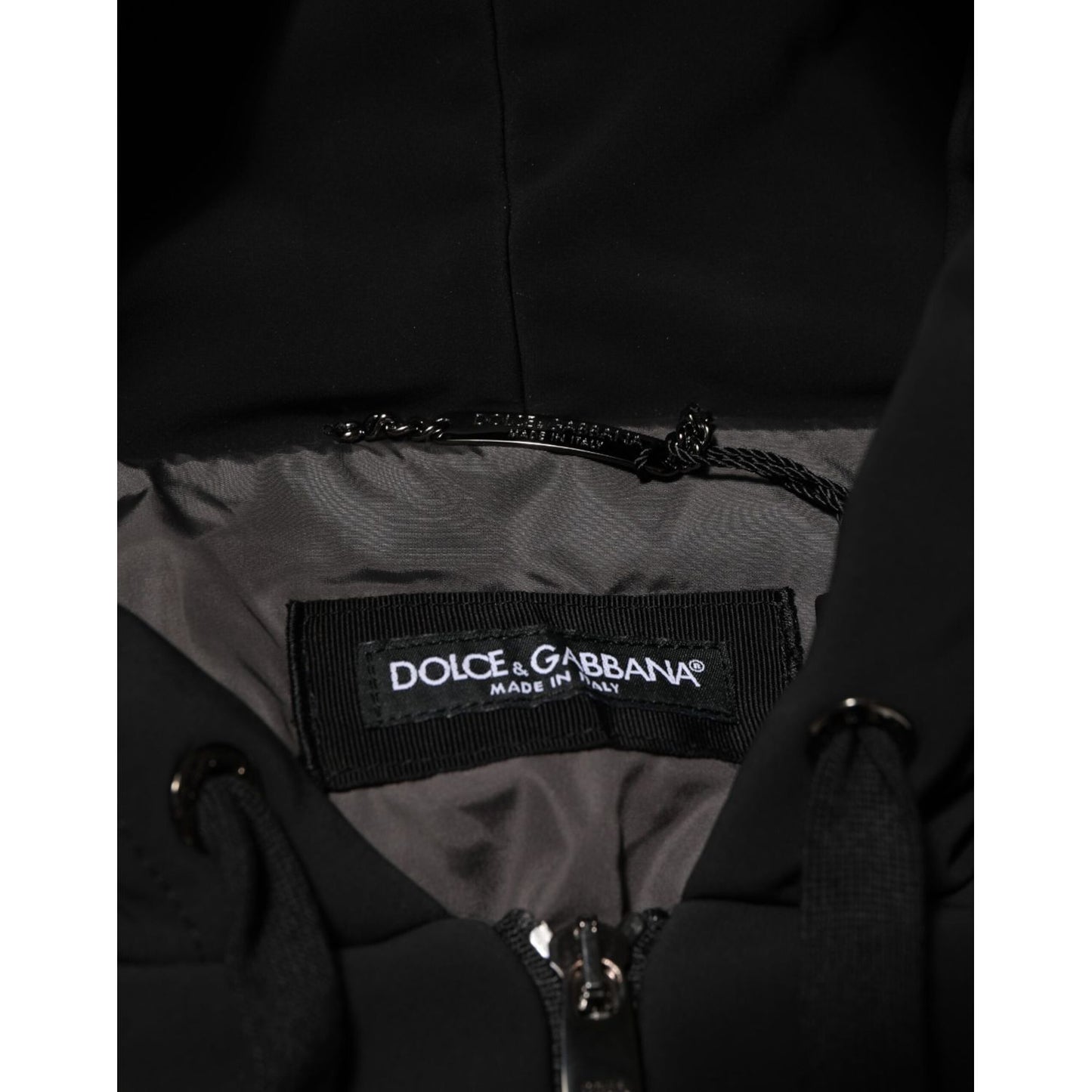 Dolce & Gabbana Black Cotton Quilted Studded Sleeve Hoodie Jacket with brand label showing inside the collar.