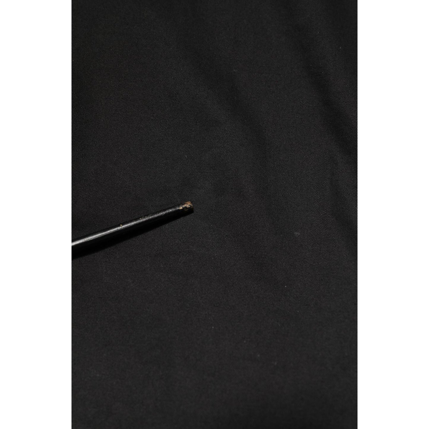 Image showing minor defect on Dolce & Gabbana Black Cotton Tapered Men Formal Trousers Pants fabric.