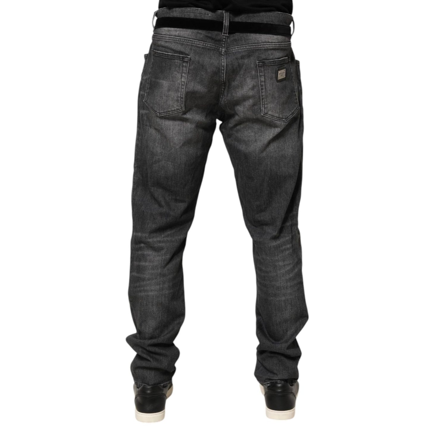 Back view of Dolce & Gabbana Black Gray Wash Slim Fit Straight Leg Denim Jeans on model, showcasing five-pocket style and whiskering effect.
