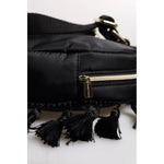 Close-up of Dolce & Gabbana Black Heart L'Amore Patch Embellished Kids Backpack with zipper and tassel details.