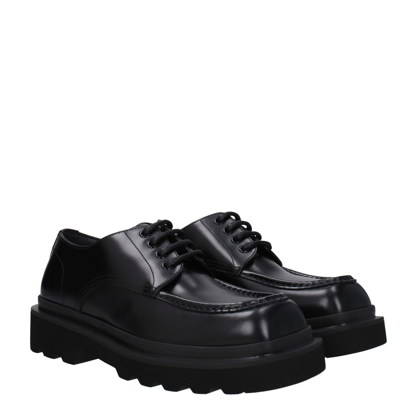 Dolce & Gabbana Black Leather Oxfords And Derbies with round toe and lace-up closure, featuring mid heels and rubber sole.