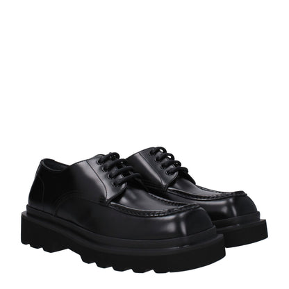 Dolce & Gabbana Black Leather Oxfords And Derbies with round toe and lace-up closure, featuring mid heels and rubber sole.