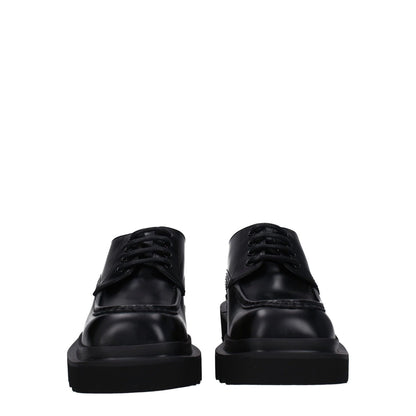 Dolce & Gabbana Black Leather Oxfords And Derbies, lace up, round toe, mid heel, casual style with rubber sole.