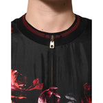 Close-up of Dolce & Gabbana Black Red Floral Silk Bomber Blouson Jacket with ribbed burgundy collar and floral print.
