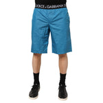 Dolce & Gabbana Blue Logo Waistband Beachwear Shorts Swimwear, featuring elastic waistband with logo, vibrant blue summer shorts.