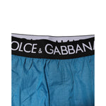 Dolce & Gabbana Blue Logo Waistband Beachwear Shorts Swimwear with black elastic waistband featuring logo, vibrant summer style.