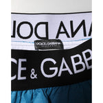 Close-up of Dolce & Gabbana Blue Logo Waistband Beachwear Shorts Swimwear showcasing the brand's iconic logo on the waistband.