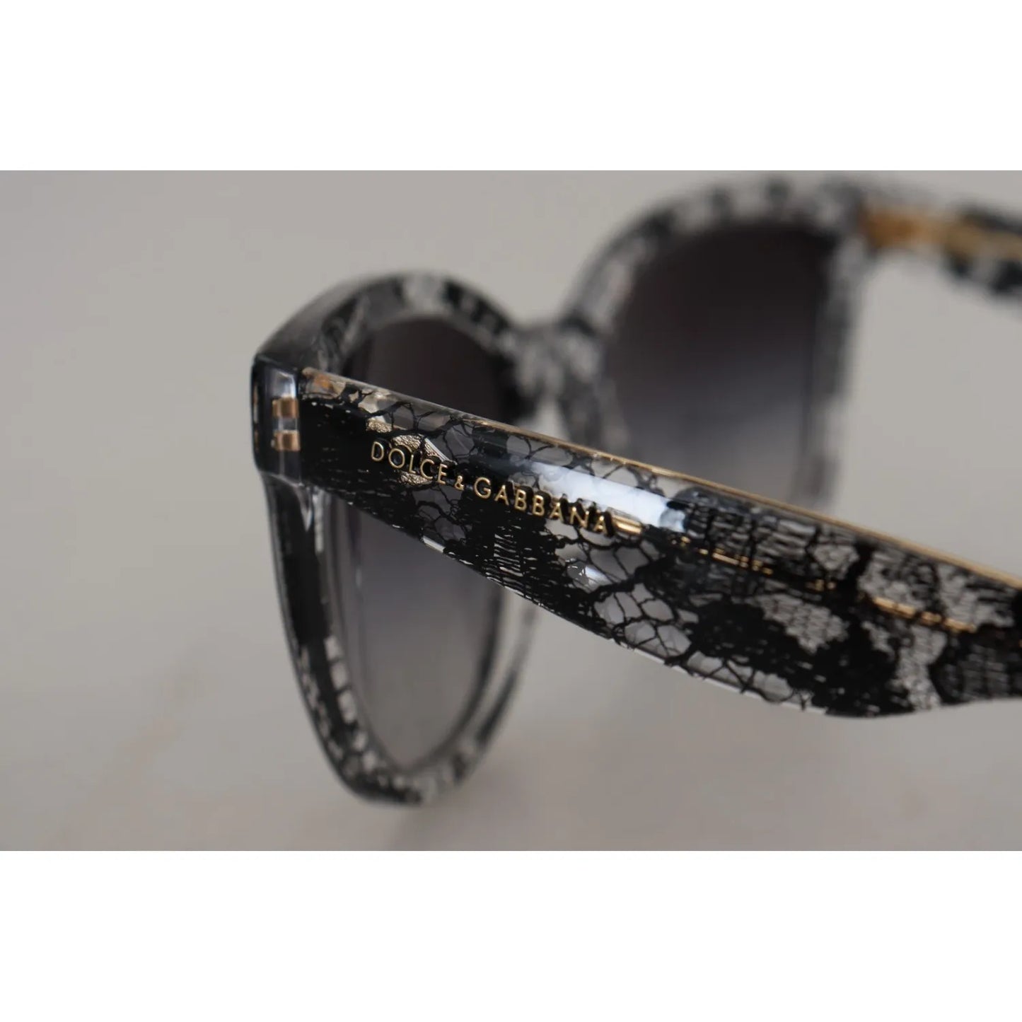 Dolce & Gabbana DG4190 Black Lace Acetate Crystal Round Sunglasses with gray gradient lens and UV protection for women.